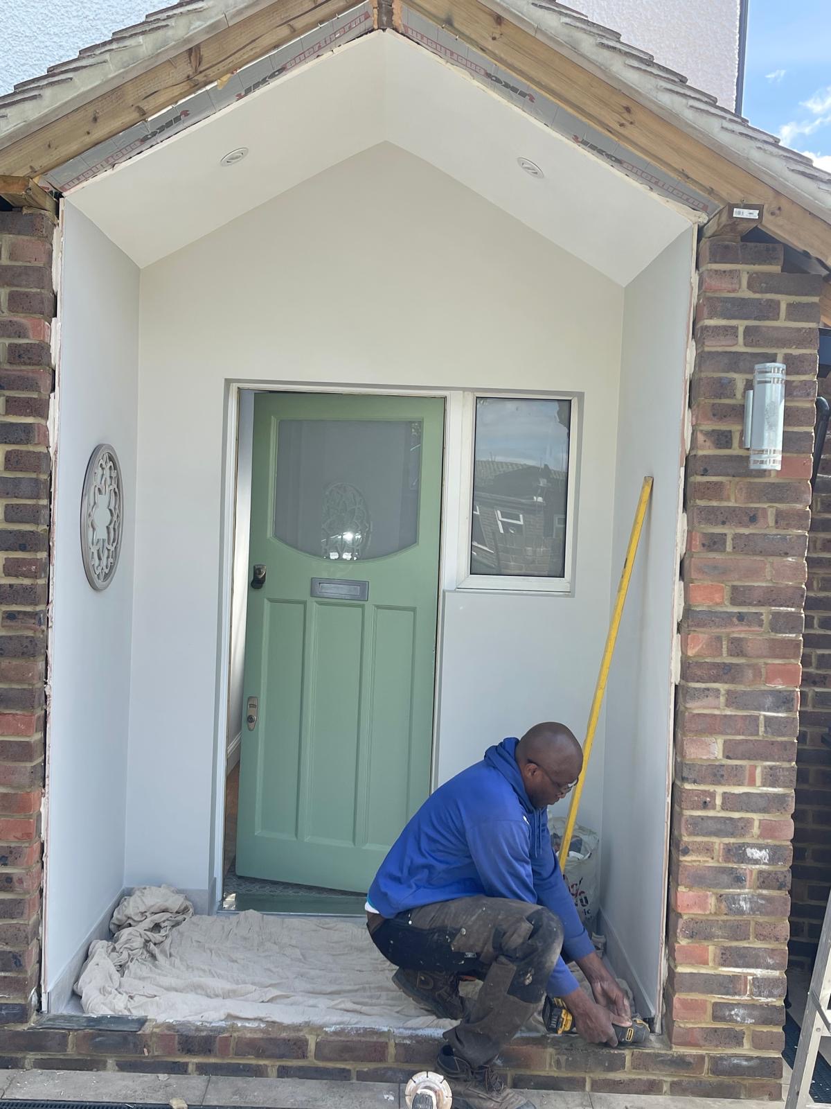 Echelon Windows team installing a composite front door in South London